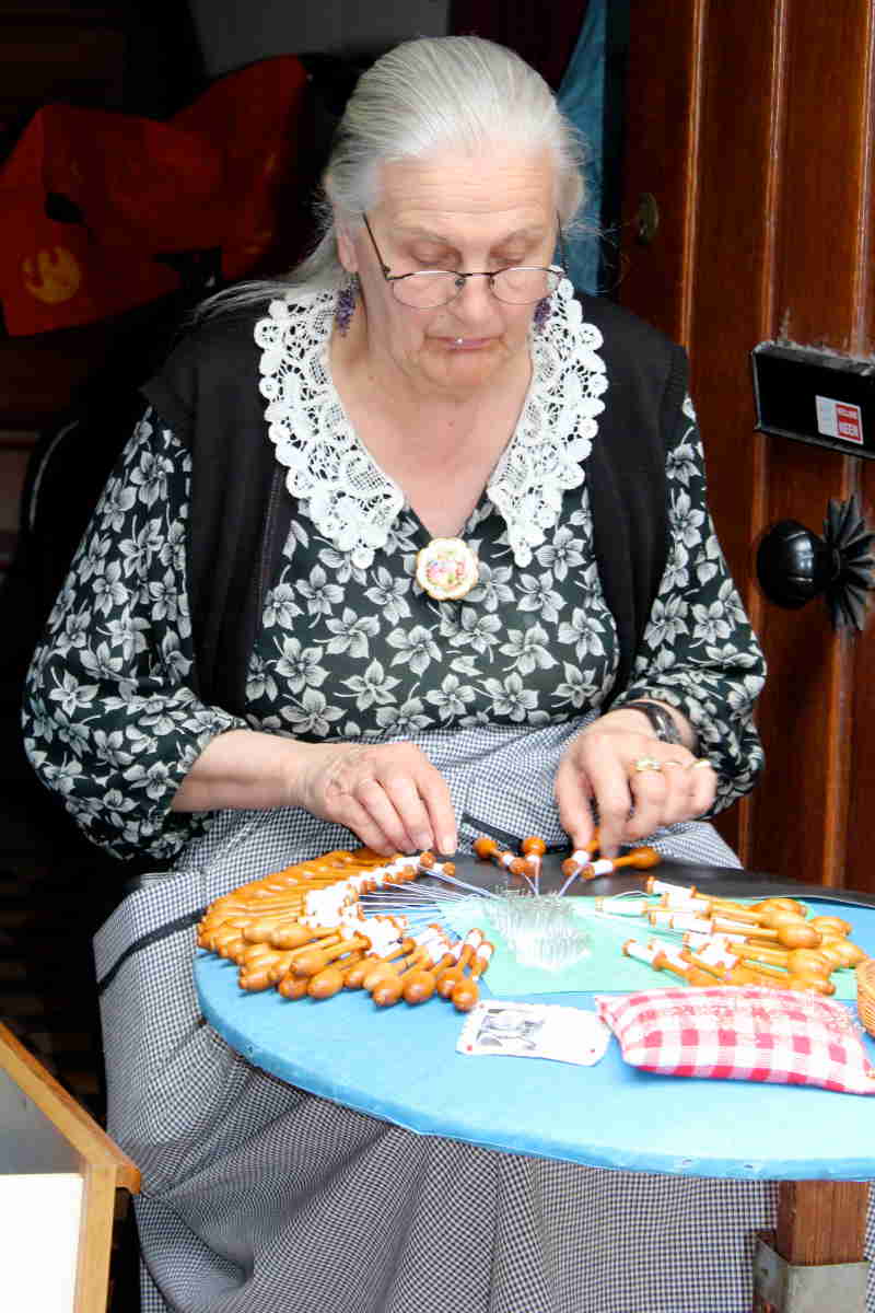 Woman making lace Bruges Belgium History Comes Alive
