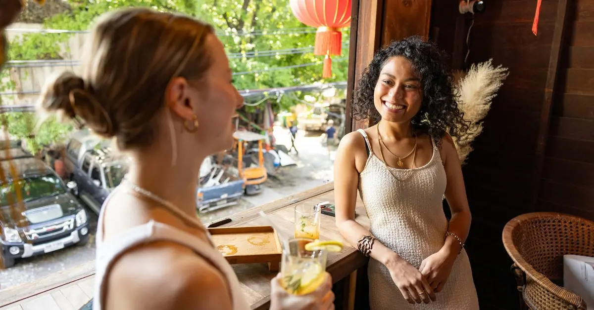 Traveler engaging with locals – How to Meet Locals When Traveling and build genuine connections during your journeys around the world